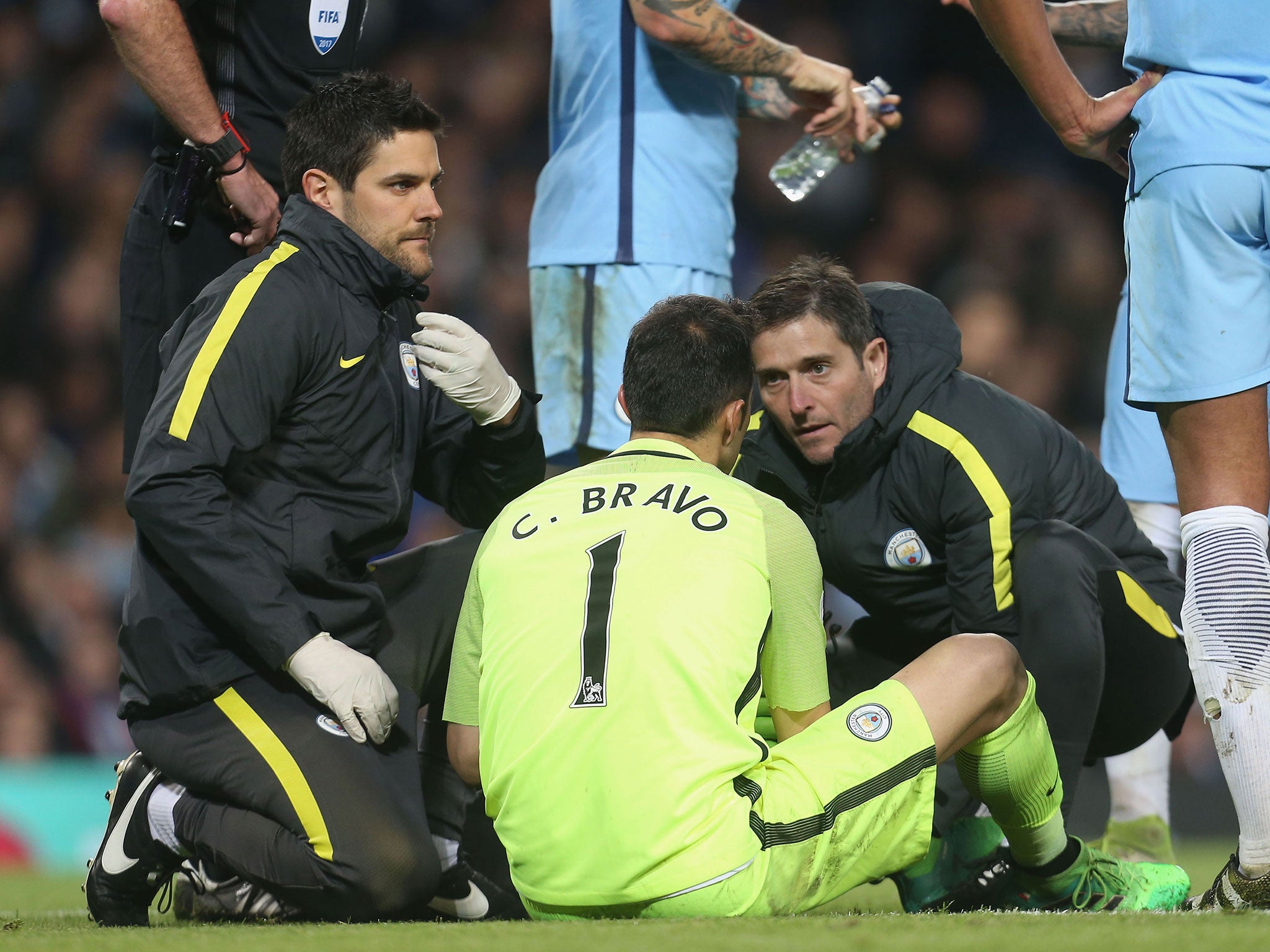Bravo receives treatment after sustaining an injury to his calf