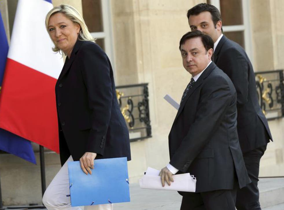Marine Le Pen arrives at the Elysee Palace in Paris with National Front Vice-Presidents Jean-Francois Jalkh (centre) and Florian Philippot