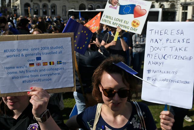 A lost cause? Pro-EU protester holds up placard against Brexit in Rome ahead of 60th anniversary celebrations