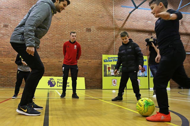 Youngsters from Middlesbrough take part in a session with defender George Friend