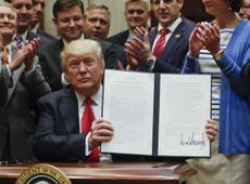 Trump signs order ripping up Obama's protections against drilling