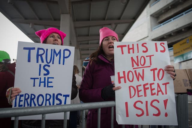 Protesters gather at JFK International Airport to demonstrate against US President Donald Trump's executive order