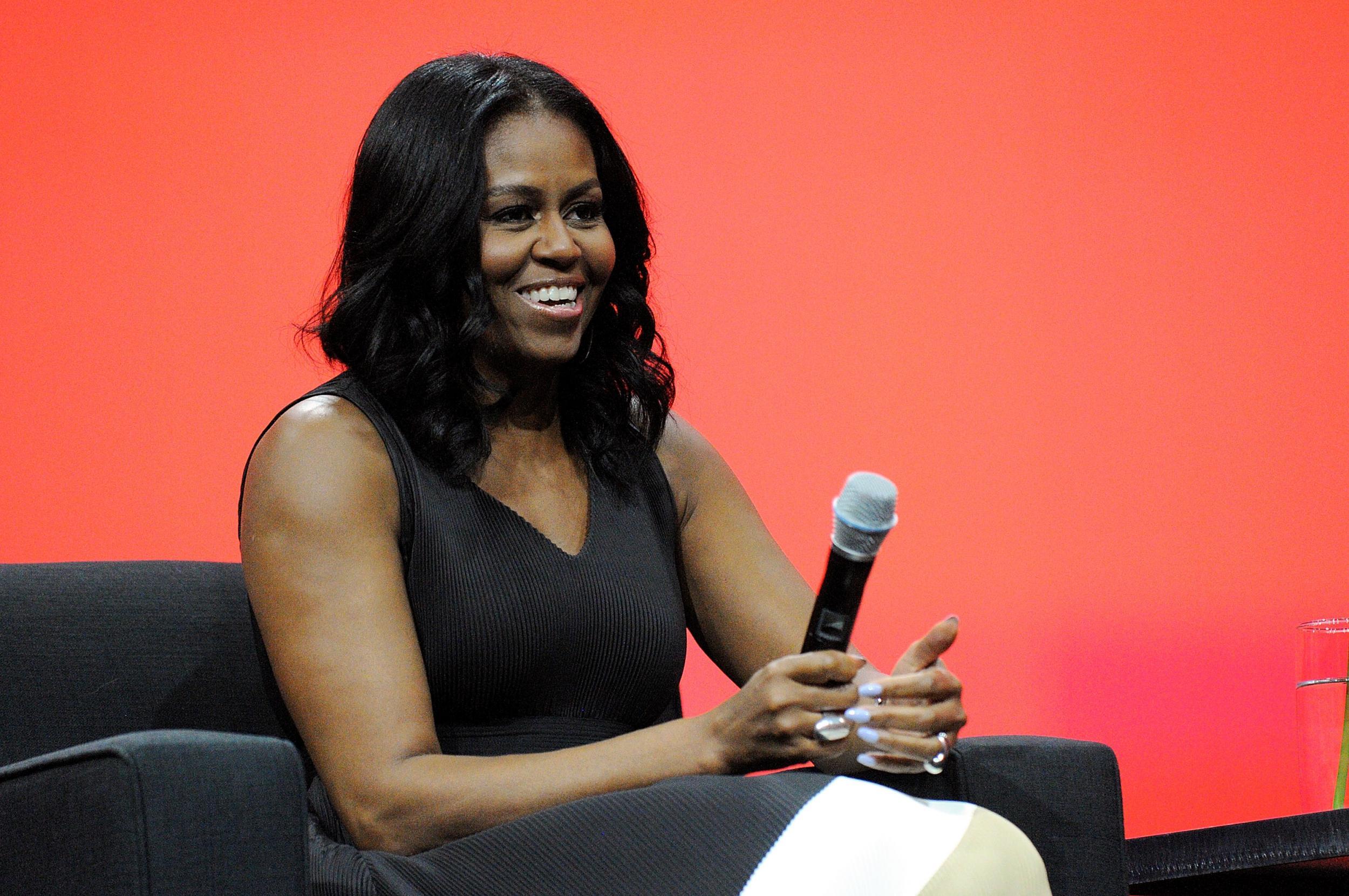 Michelle Obama smiles during a conversation at the AIA Conference on Architecture 2017