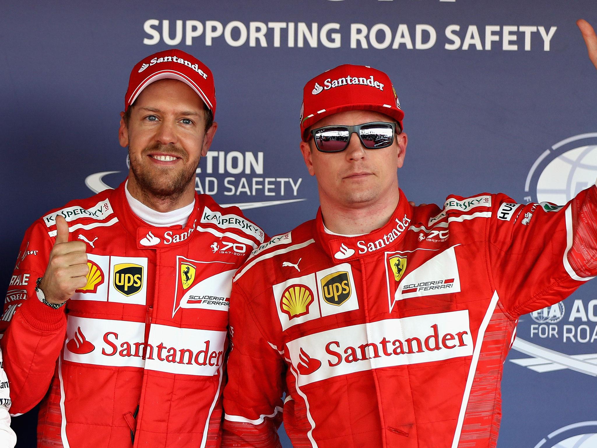 Sebastian Vettel and Kimi Raikkonen celebrate their front-row lockout in qualifying for the Russian Grand Prix