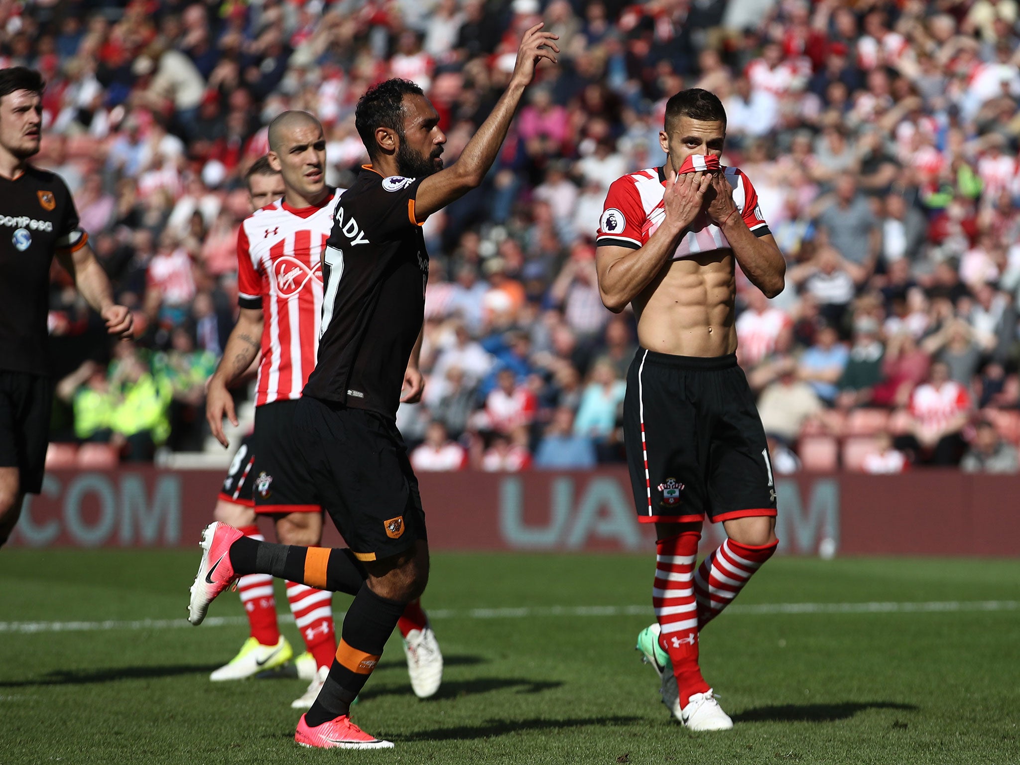 Dusan Tadic reacts to seeing his penalty saved