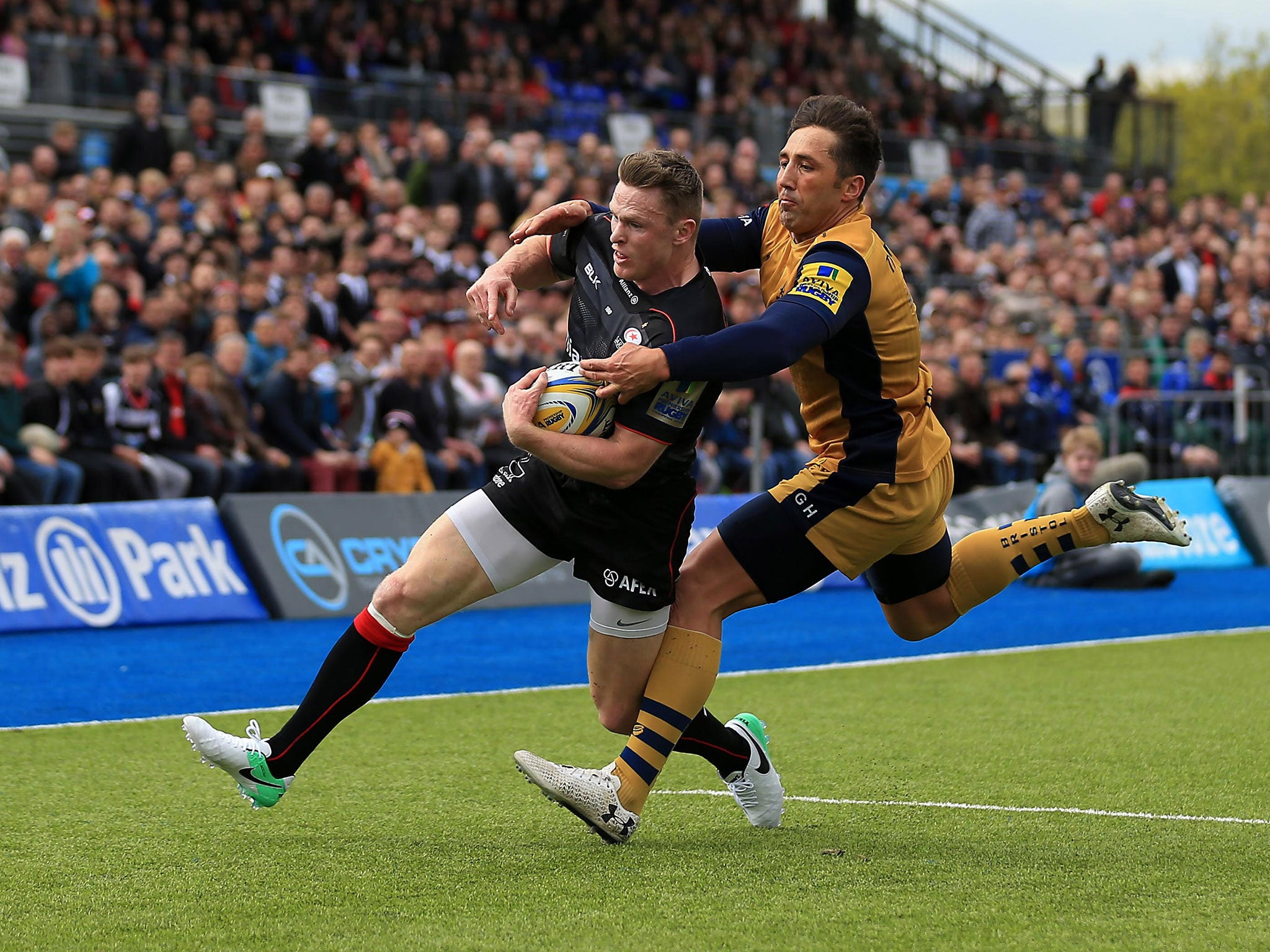 Chris Ashton dives over the line to score despite Gavin Henson's last-ditch tackle