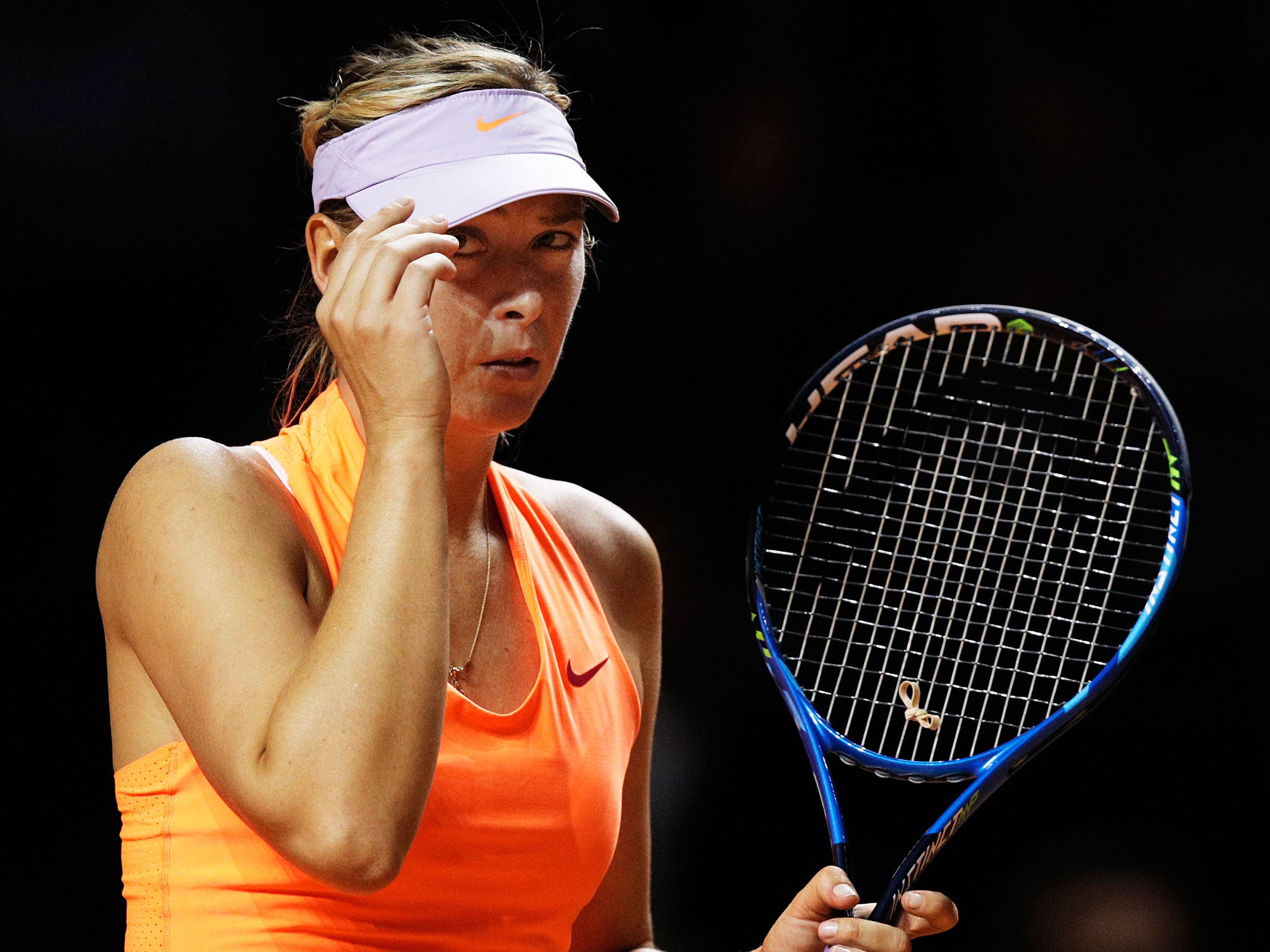 Maria Sharapova was knocked out of the Porsche Grand Prix by Kristina Mladenovic