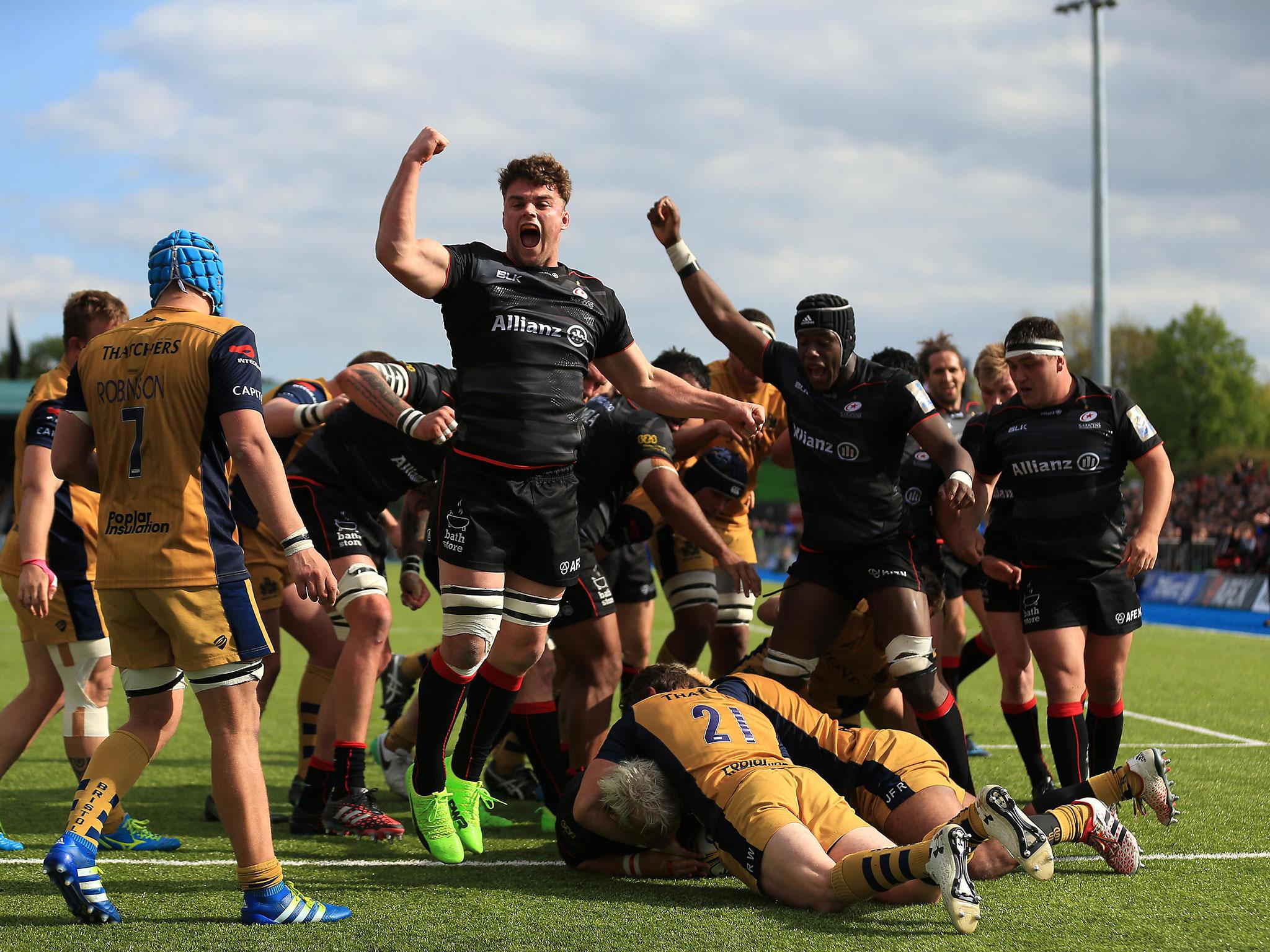 Saracens celebrate after driving Petrus du Plessis over the line for one of his two tries
