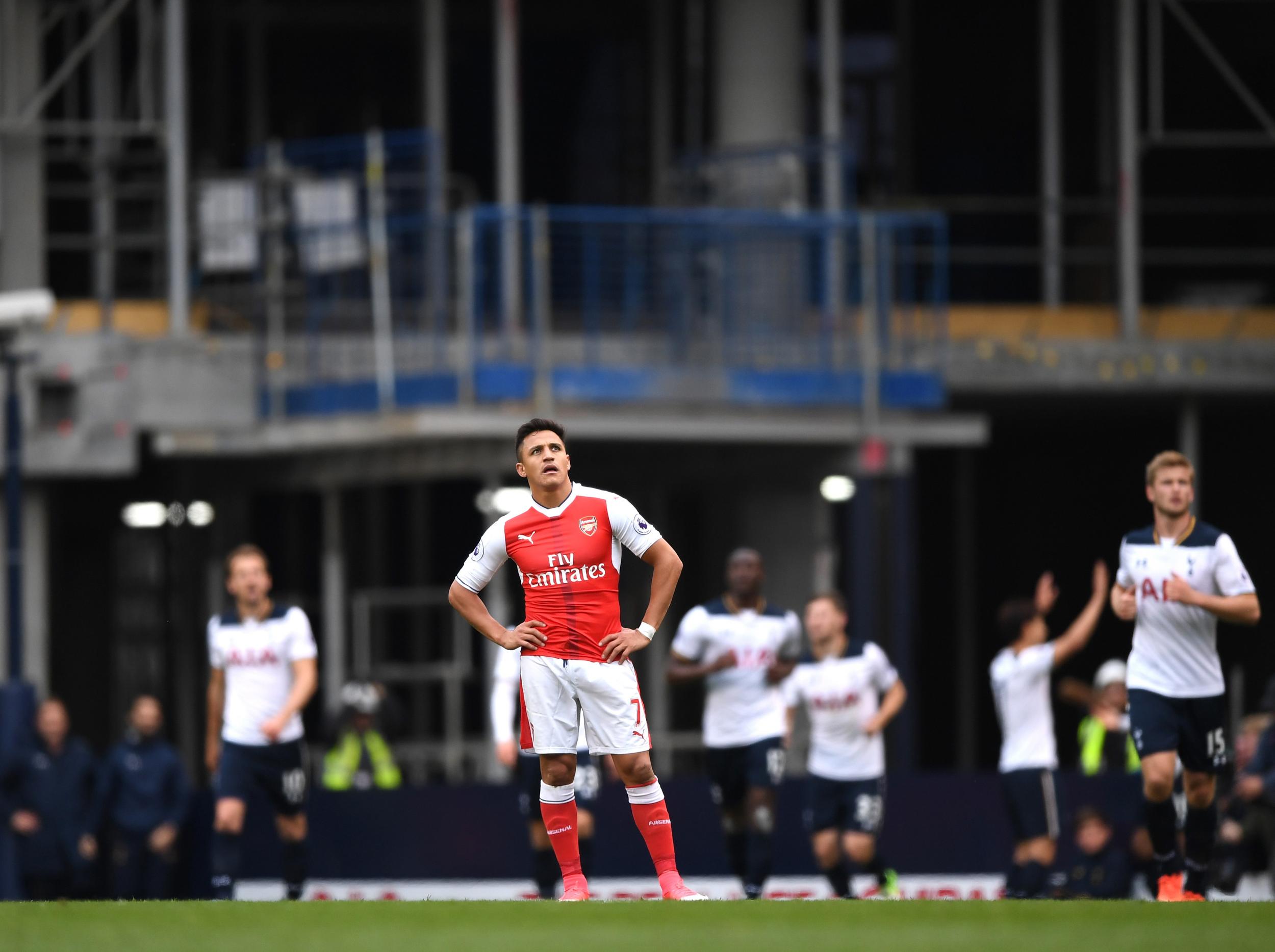 Sanchez stands dejected as Spurs celebrate their second