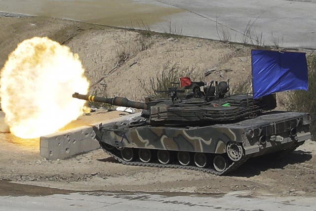 A South Korean army's K1A2 tank fires a round during the South Korea-US joint military live-fire drills at Seungjin Fire Training Field in Pocheon, South Korea, near the border with North Korea