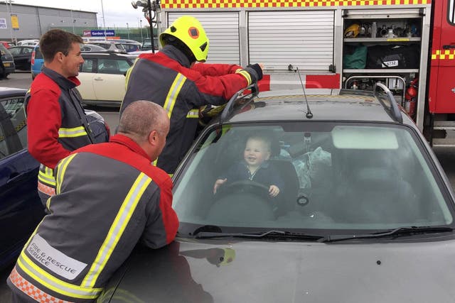 Firefighters rescuing 14-month-old Brandon from his mother's car in Bude, Cornwall