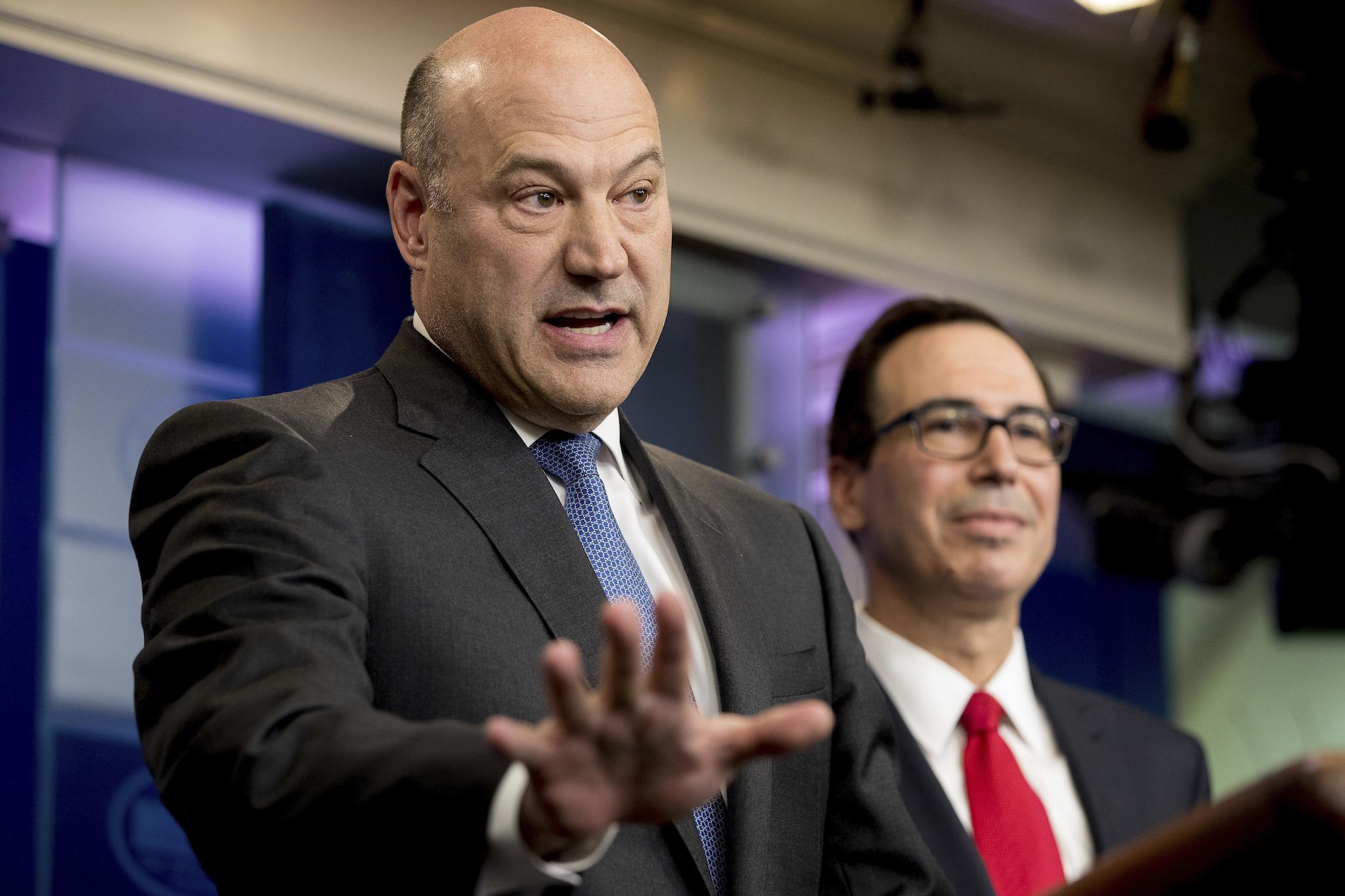 National Economic Director Gary Cohn, left, accompanied by Treasury Secretary Steve Mnuchin, speaks in the briefing room of the White House