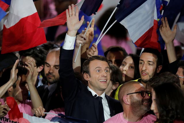 Emmanuel Macron attending a campaign rally in Paris, where his rival Marine Le Pen was also attempting to drum up support