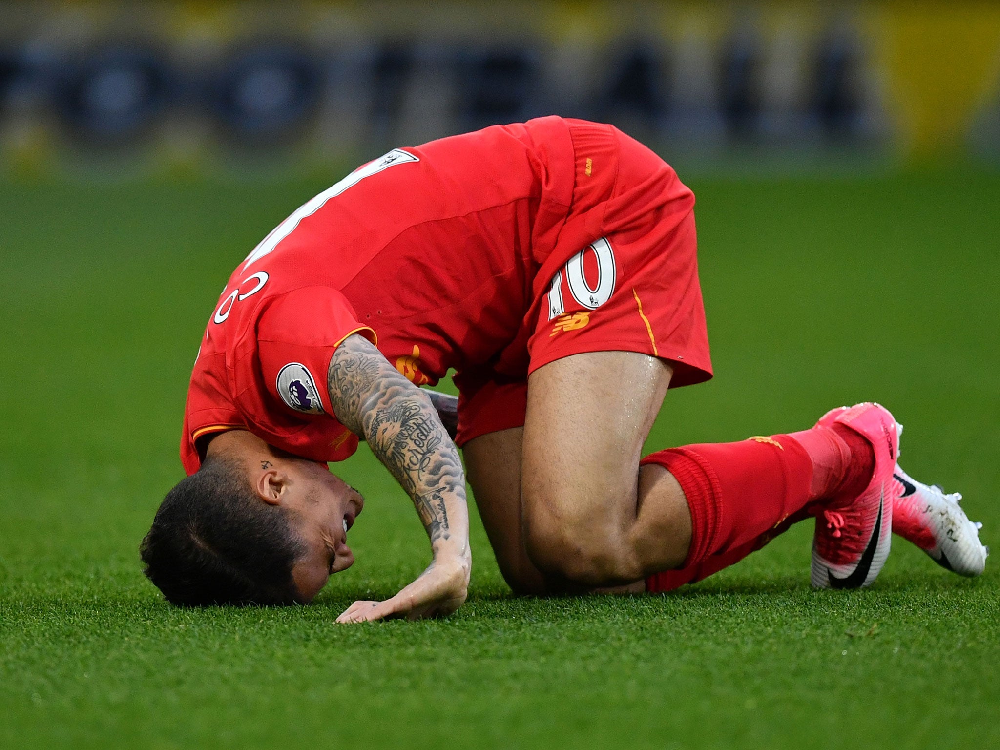 Coutinho reacts after being ran into by Mariappa