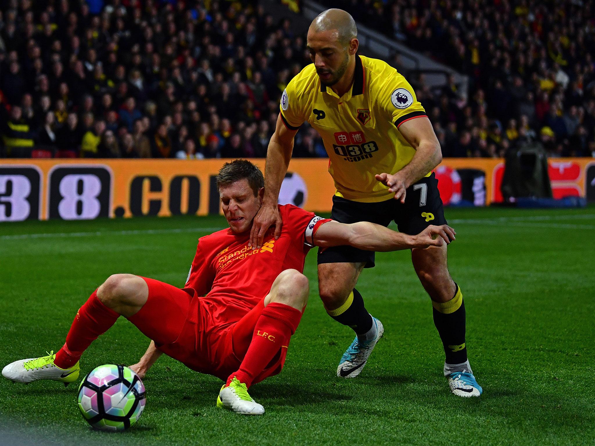 James Milner struggles under pressure from Nordin Amrabat