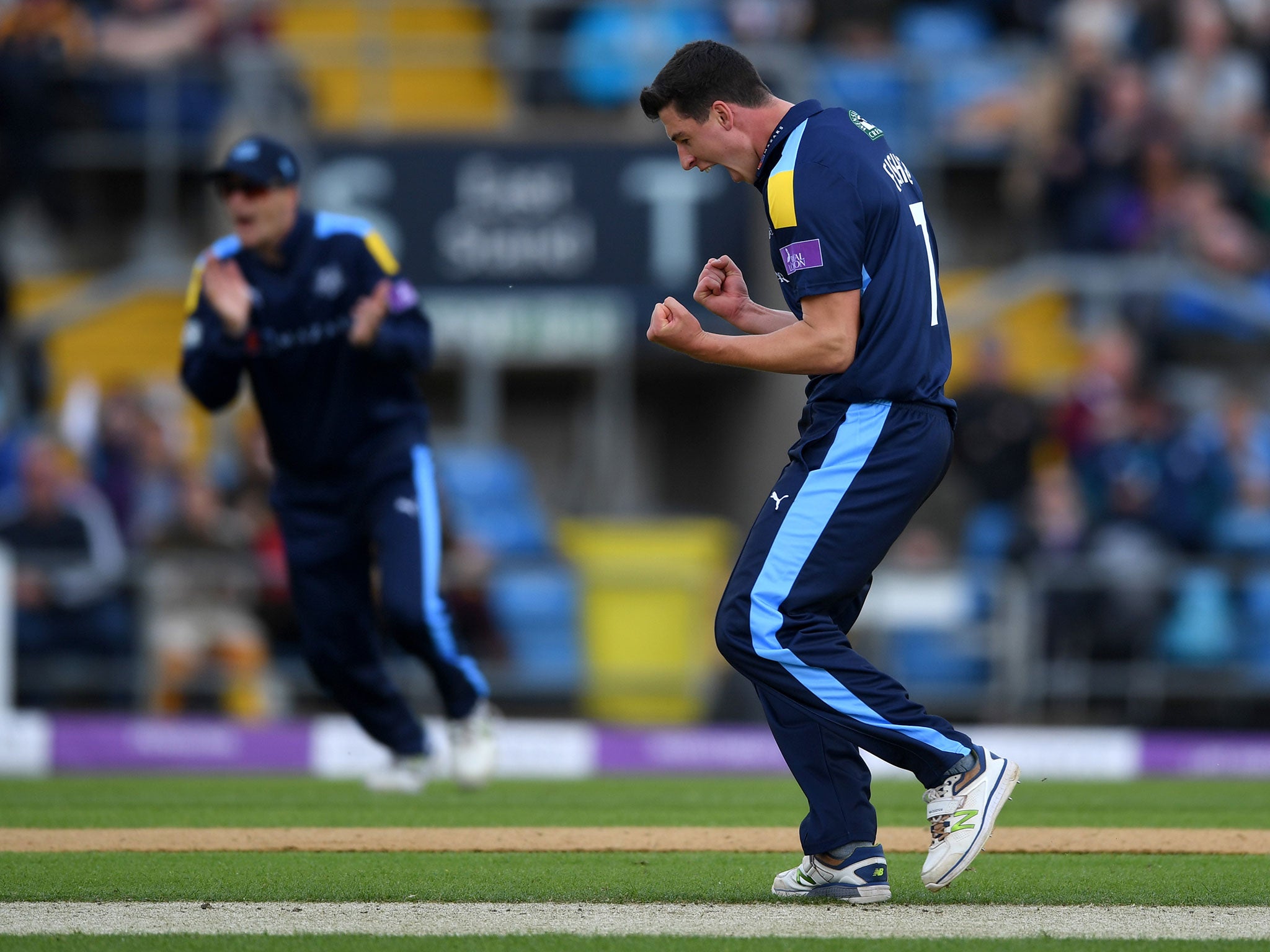 Matthew Fisher of Yorkshire celebrates dismissing Haseeb Hameed