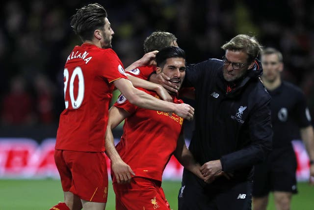 Jurgen Klopp celebrates with Emre Can after the player's stunning goal