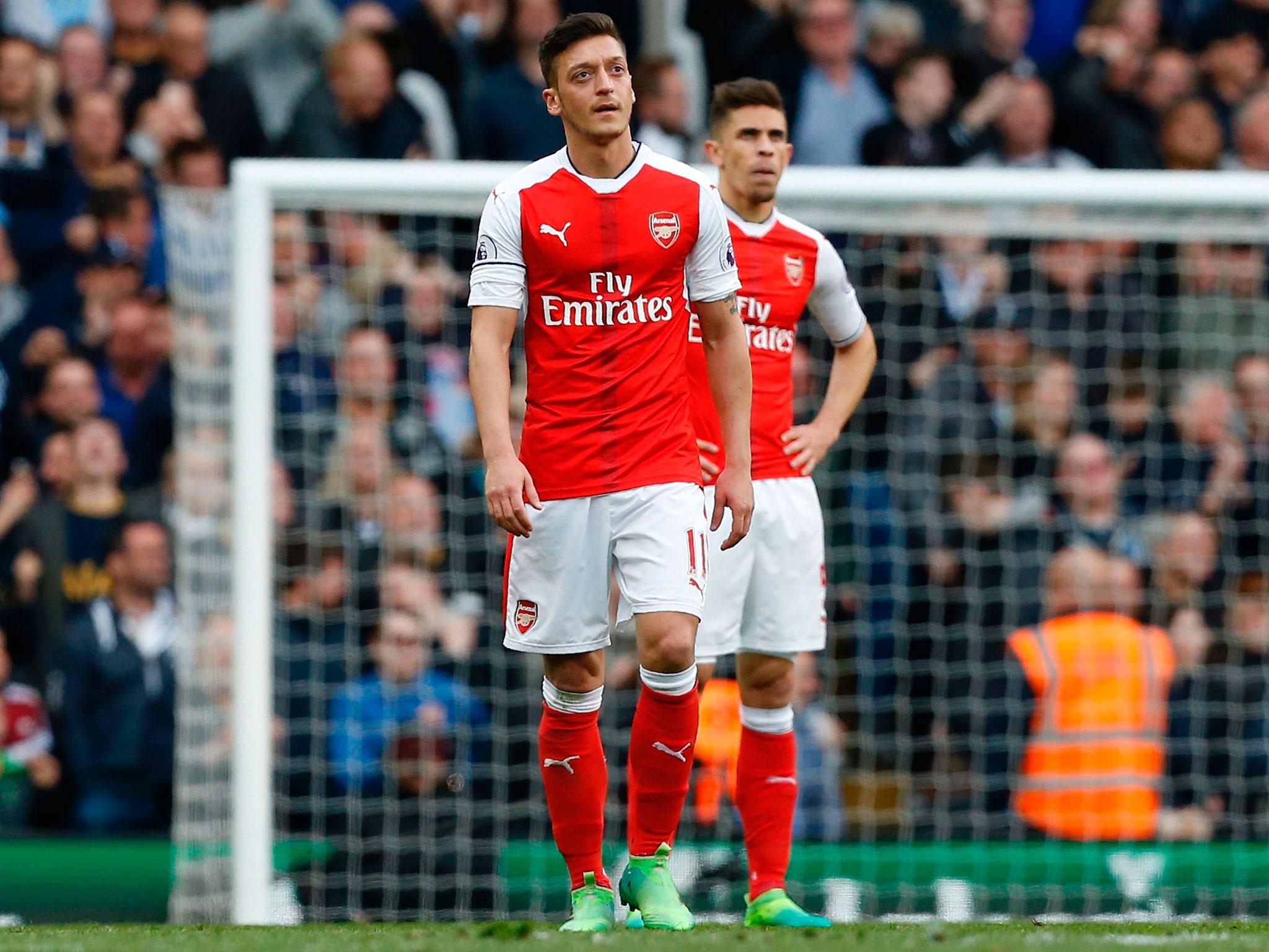 Mesut Özil kicks door after Arsenal's defeat by Tottenham in angry ...