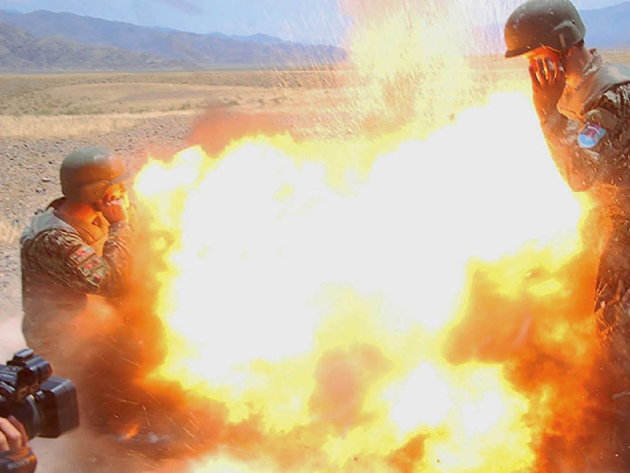 Afghan soldiers as a mortar tube accidentally explodes during an Afghan National Army live-fire training exercise in Laghman province, Afghanistan, 02 July 2013