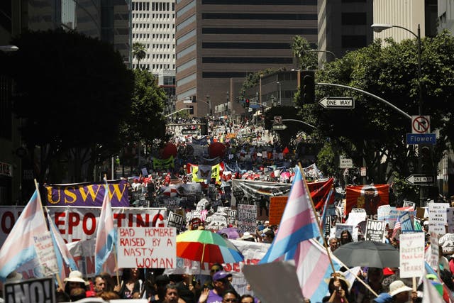 Thousands marched through downtown Los Angeles in a May Day protest against Donald Trump