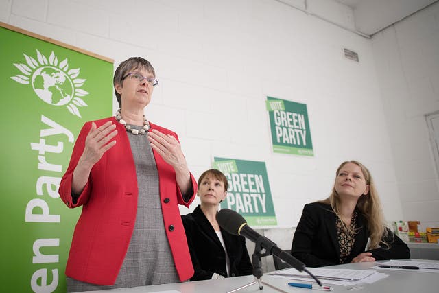 Green MEP Molly Scott Cato speaks during the launch of the Green Party Brexit policy watched by Co-Leader of the Green Party, Caroline Lucas and Green London Assembly member Siân Rebecca Berry at the Space Studio in London