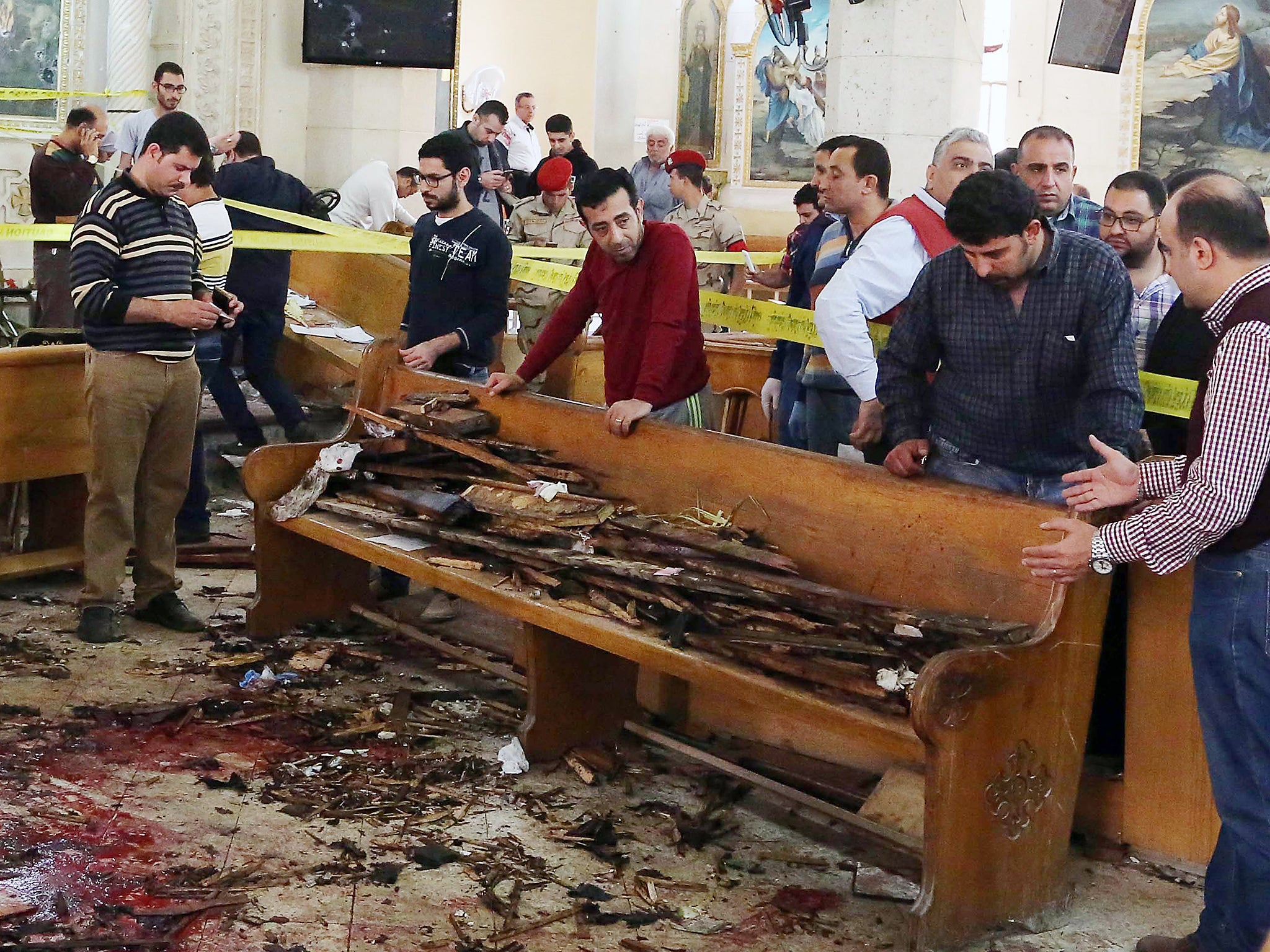Forensics evidence is gathered at the site of a bomb blast that struck worshippers at the Mar Girgis Coptic Church in the Nile Delta City of Tanta