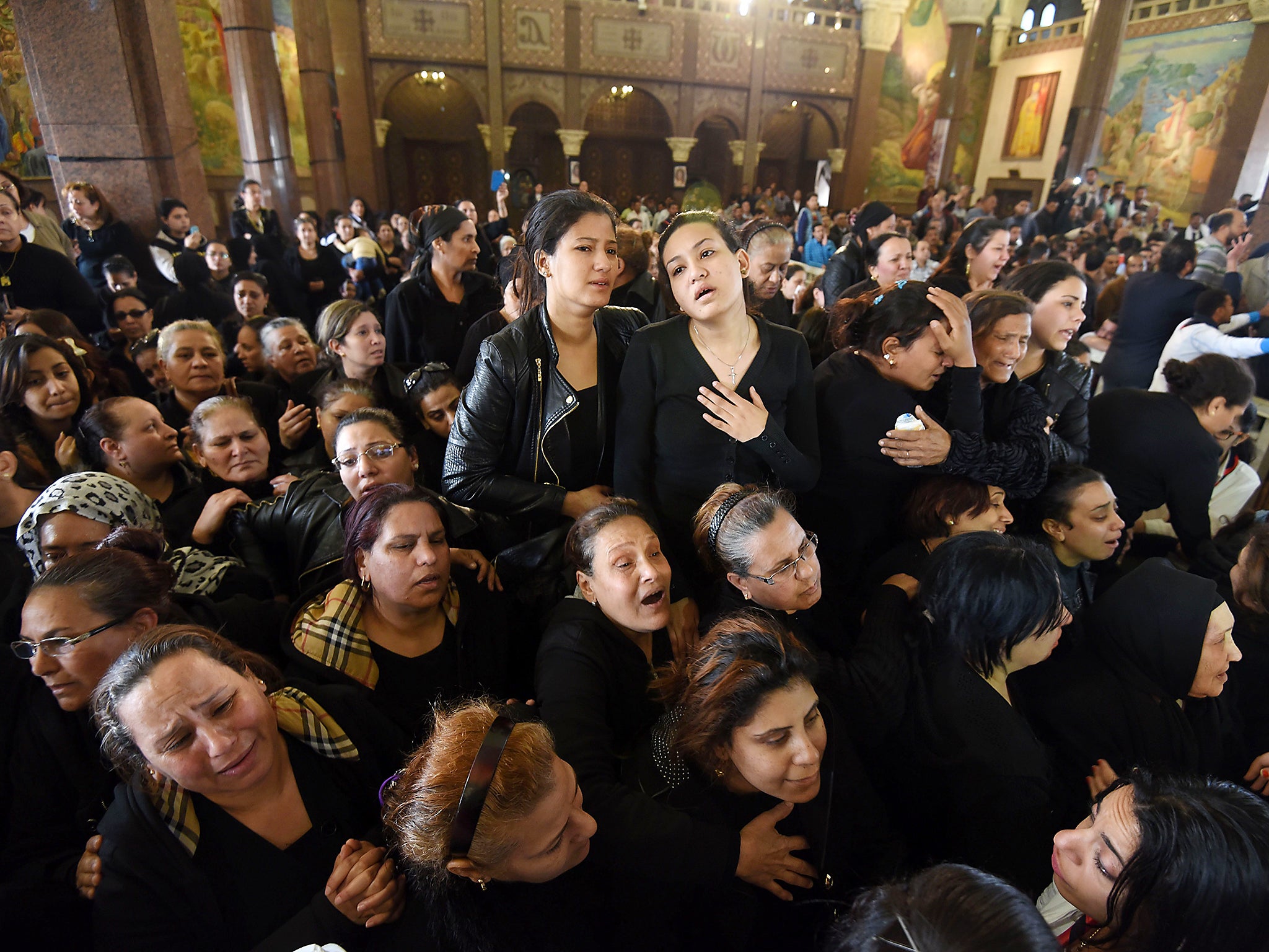 &#13;
Women mourn for the victims of the blast at the Coptic Christian Saint Mark's church in Alexandria (Getty)&#13;