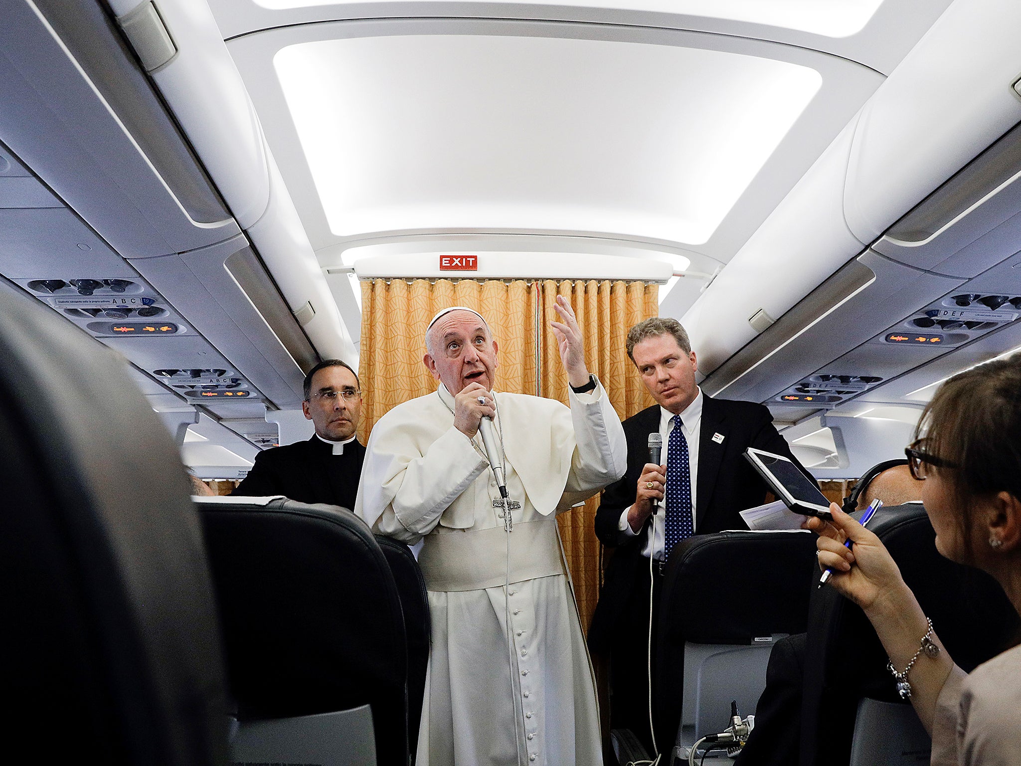 &#13;
Pope Francis speaks to the press from aboard his return flight from Cairo to Rome (Getty)&#13;