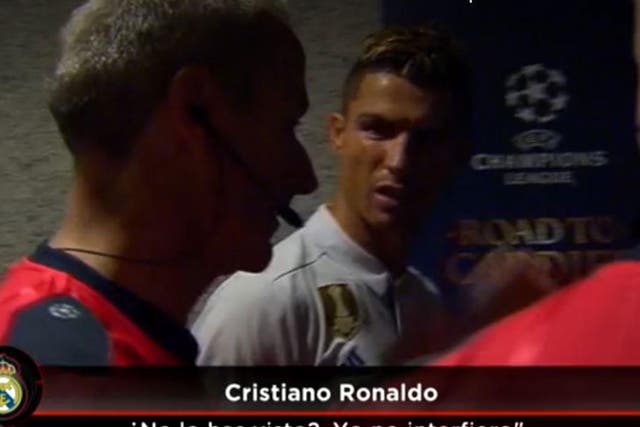 Cristiano Ronaldo confronts referee Martin Atkinson to claim he was not interfering in play before scoring his first goal