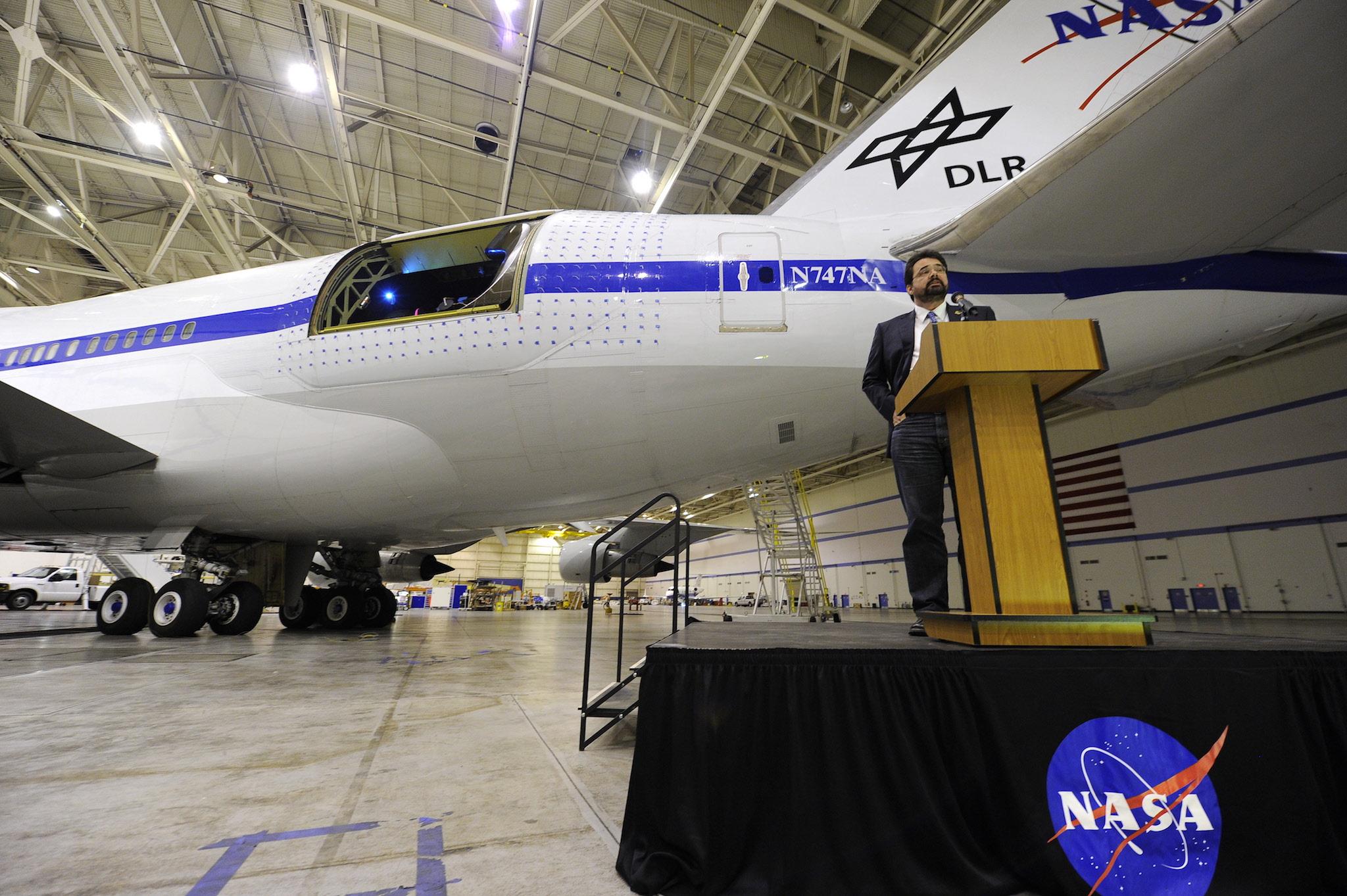 &#13;
German telescope engineer Thomas Keilig of the German Aerospace Center (DLR) speaks below the telescope bay of the Stratospheric Observatory for Infrared Astronomy (SOFIA), a cooperative venture between NASA and German scientists, where a 2.8-meter (98-inch) telescope has been mounted inside a specially modified Boeing 747 (Getty)&#13;