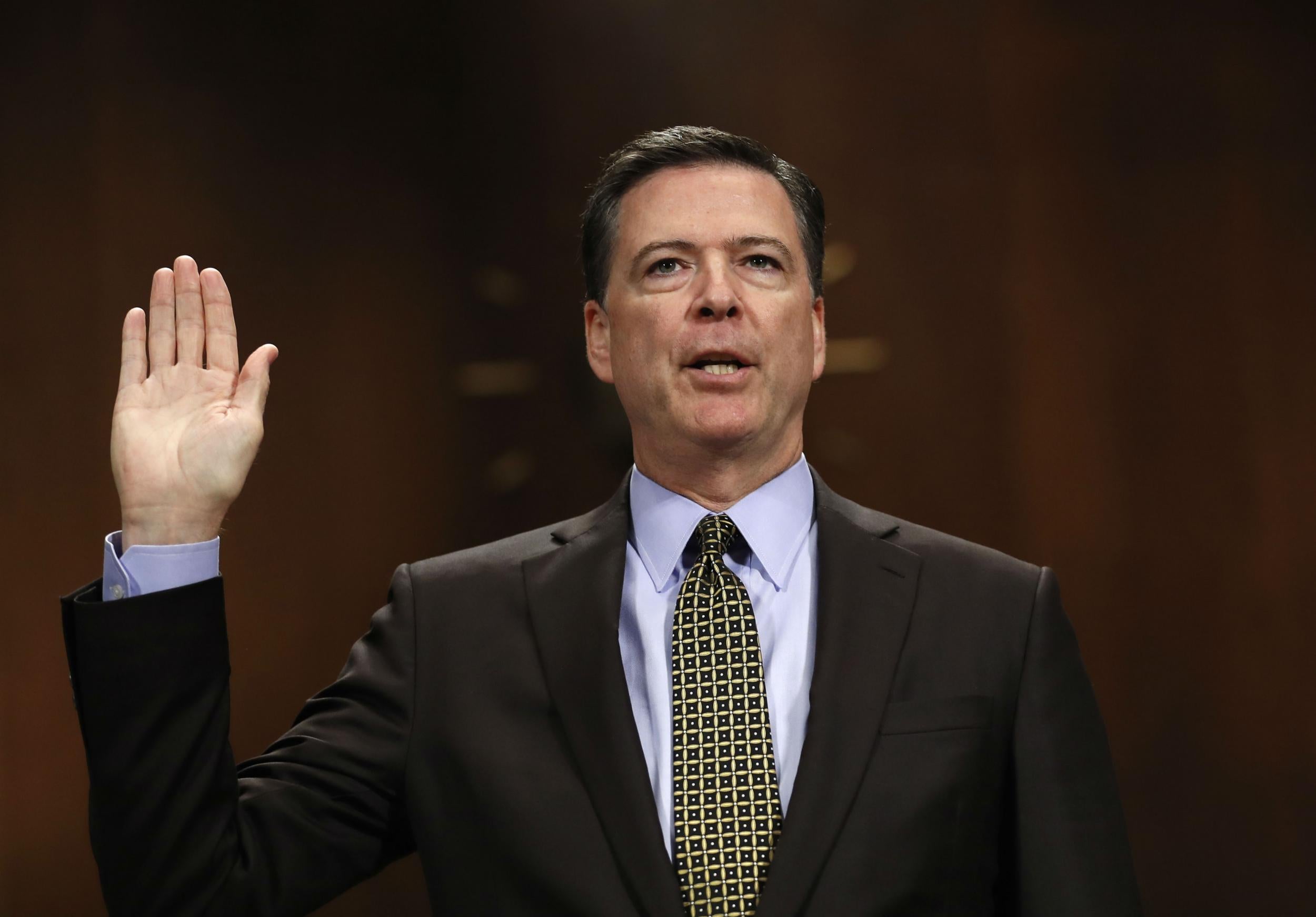 Mr Comey defended his two investigations into the presidential candidates