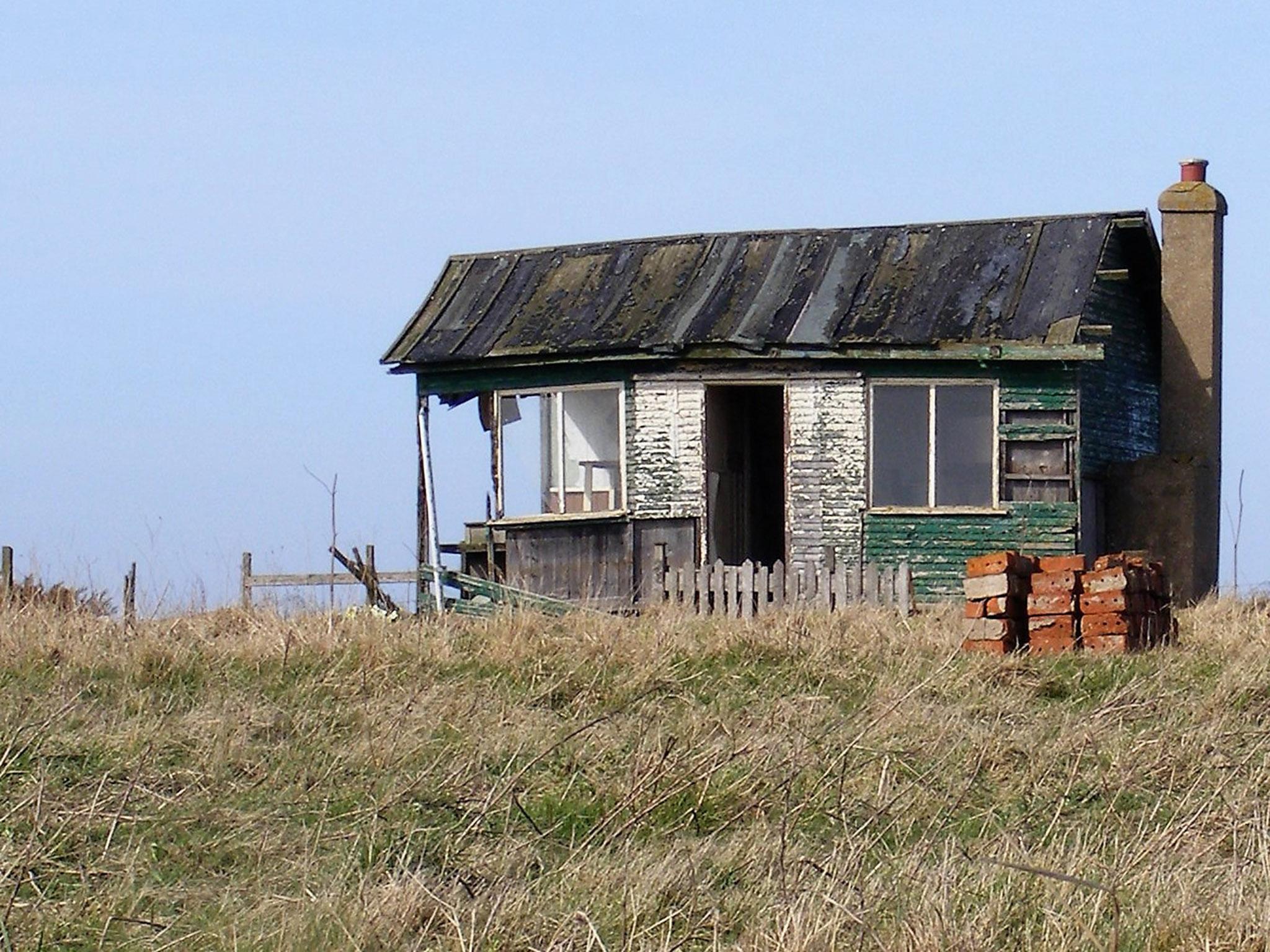 A surviving plotland dwelling on a Yorkshire cliff edge. Hardboard, discarded glass and second-hand bricks were among typical building materials