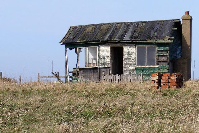 A surviving plotland dwelling on a Yorkshire cliff edge. Hardboard, discarded glass and second-hand bricks were among typical building materials
