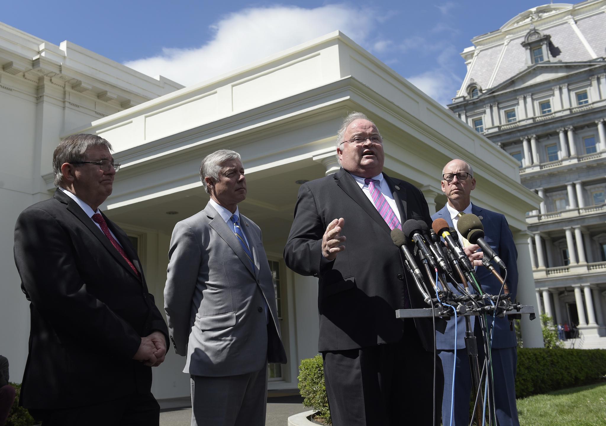 Representatives Billy Long, Michael Burgess, Fred Upton and Greg Walden speak to reporters at the White House.
