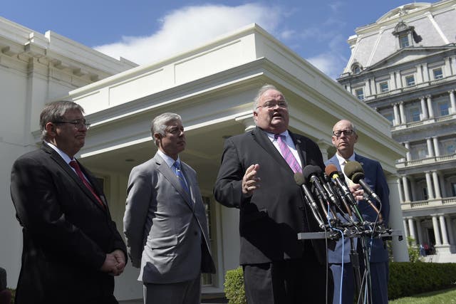 Representatives Billy Long, Michael Burgess, Fred Upton and Greg Walden speak to reporters at the White House.