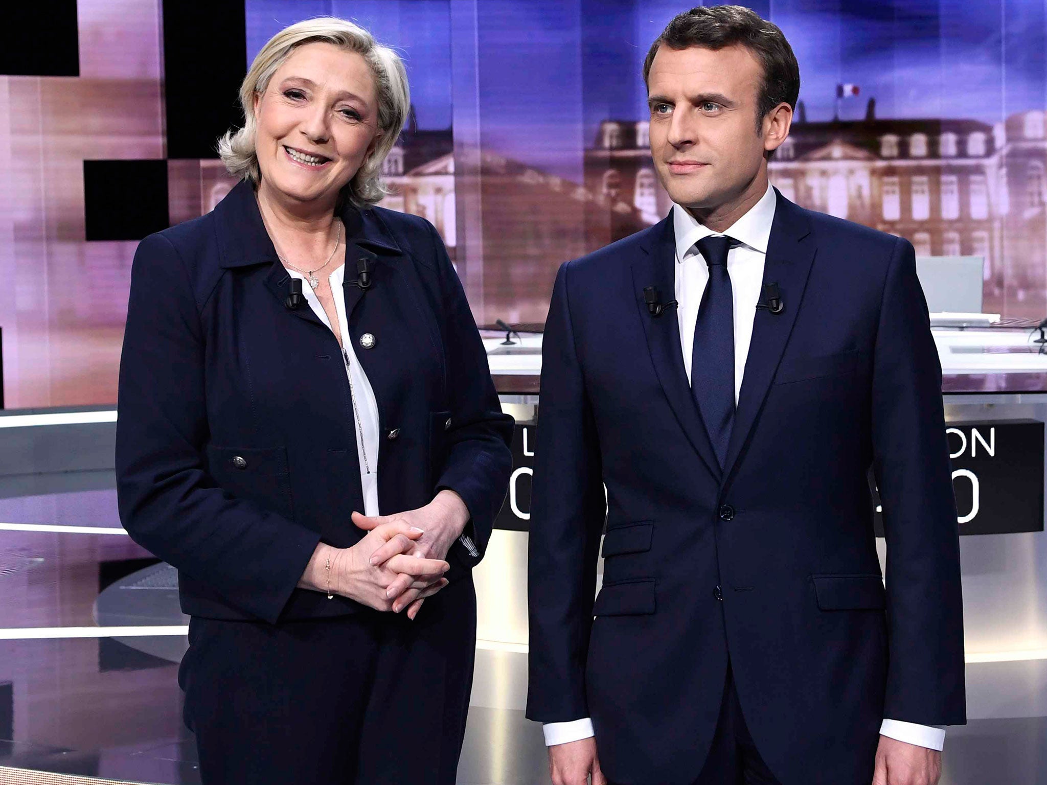 Emmanuel Macron and Marine Le Pen pose prior to the start of a television debate on 3 May