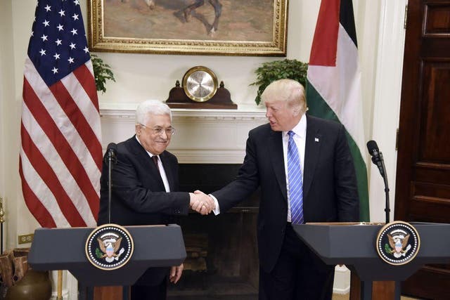 US President Donald Trump shakes hands with President Mahmoud Abbas of the Palestinian Authority after a joint statement in the Roosevelt Room of the White House on May 3, 2017 in Washington, DC
