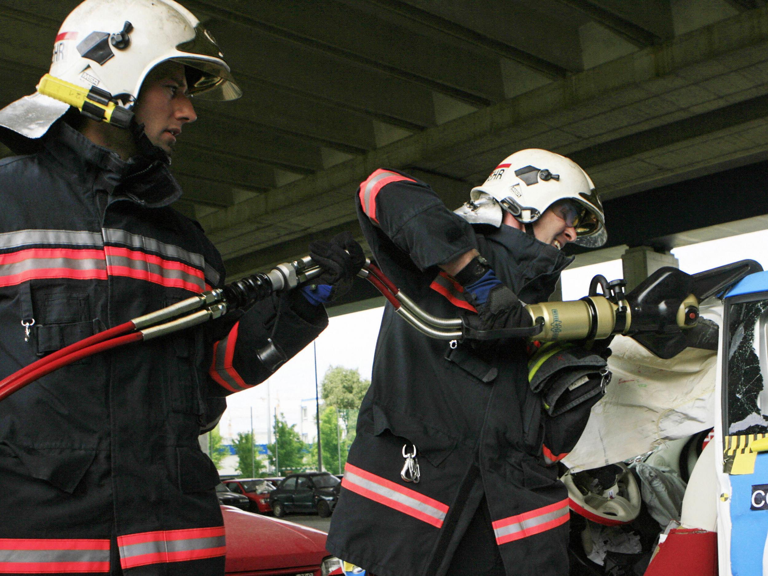 File photo of Austrian firefighters using hydraulic cutting tools in a mock car crash. Similar powerful equipment was reportedly used to remove a ring from a man's penis in east London