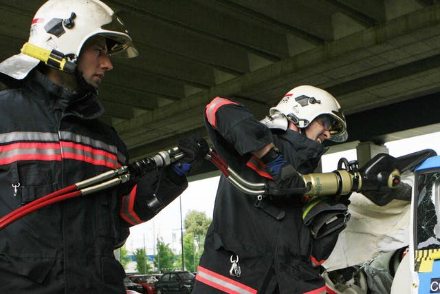 File photo of Austrian firefighters using hydraulic cutting tools in a mock car crash. Similar powerful equipment was reportedly used to remove a ring from a man's penis in east London