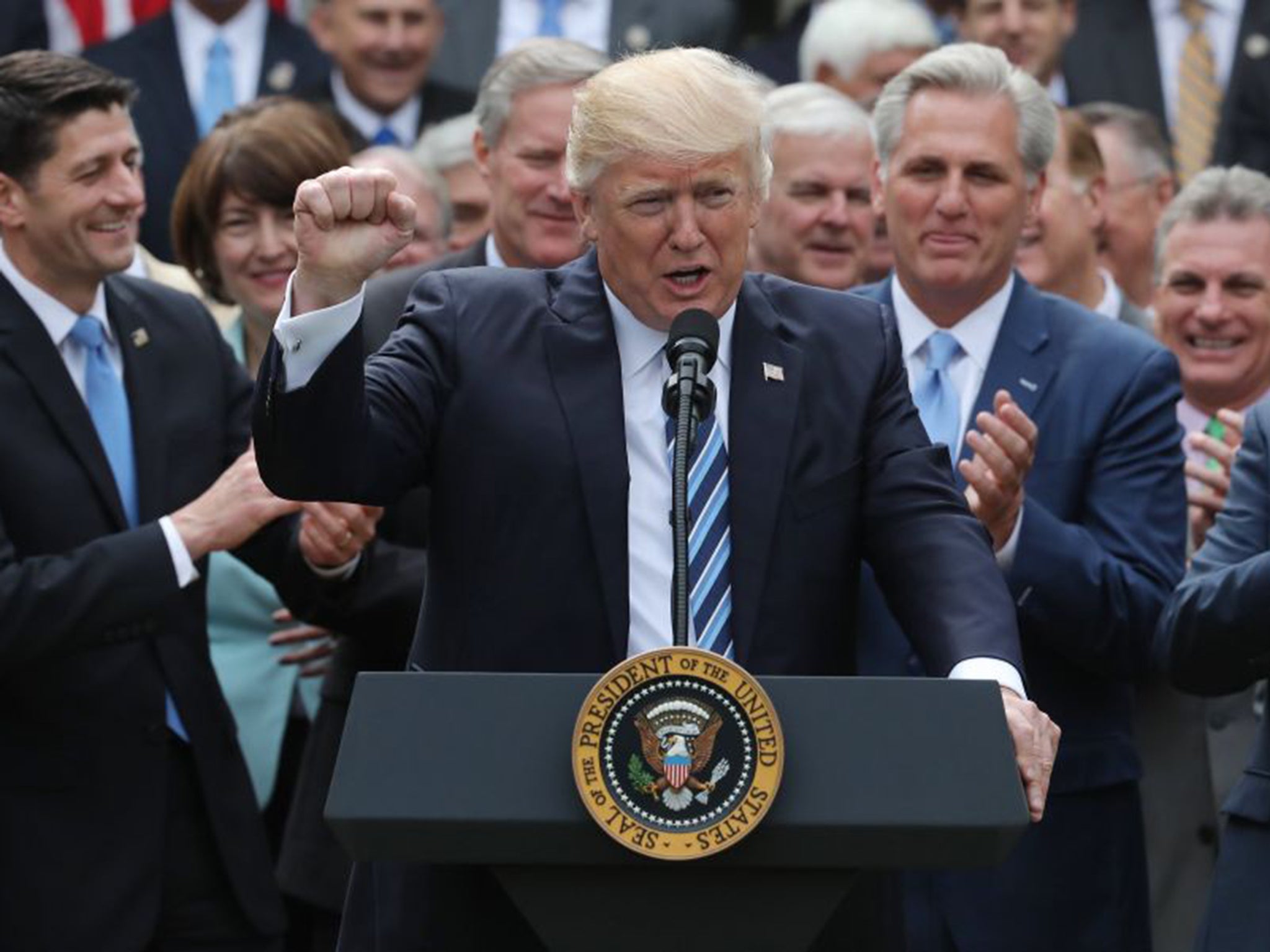 Donald Trump celebrates with Congressional Republicans in the Rose Garden of the White House after the House of Representatives approved the American Healthcare Act