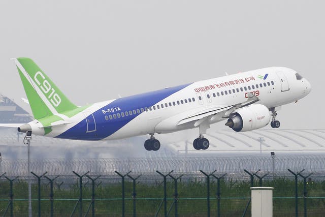The Chinese-made C919 passenger jet takes off on its first flight at Pudong International Airport in Shanghai