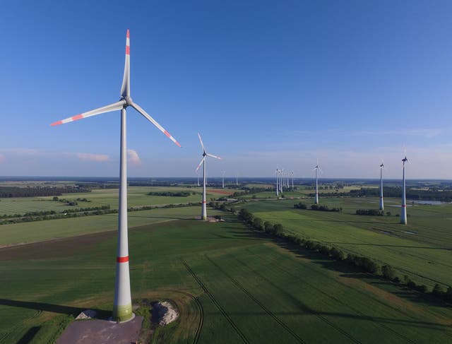 In this aerial view wind turbines spin on 8 June 2016 near Brueck, Germany