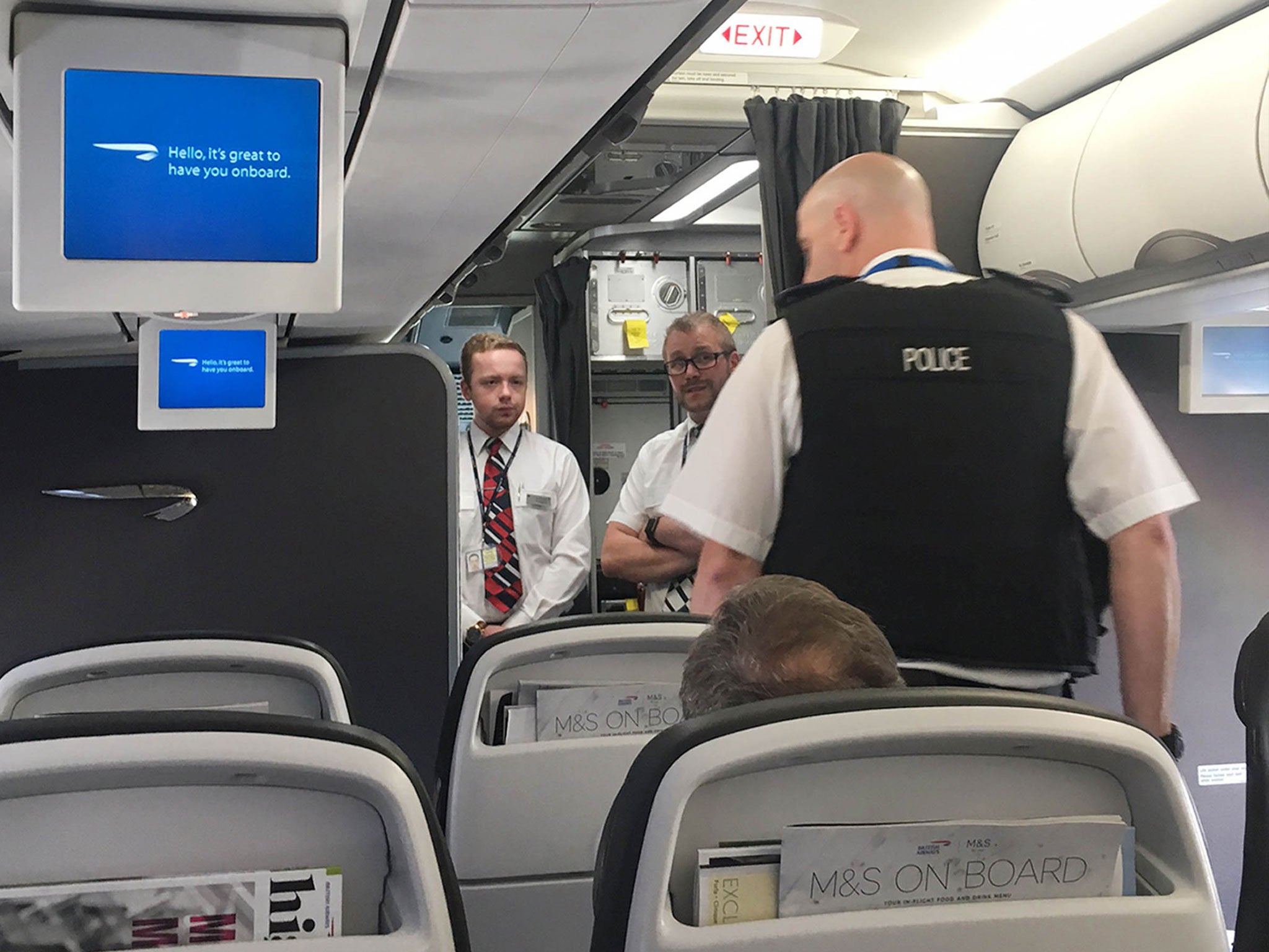 Armed police search an unidentified BA flight on the tarmac at Heathrow's Terminal 3