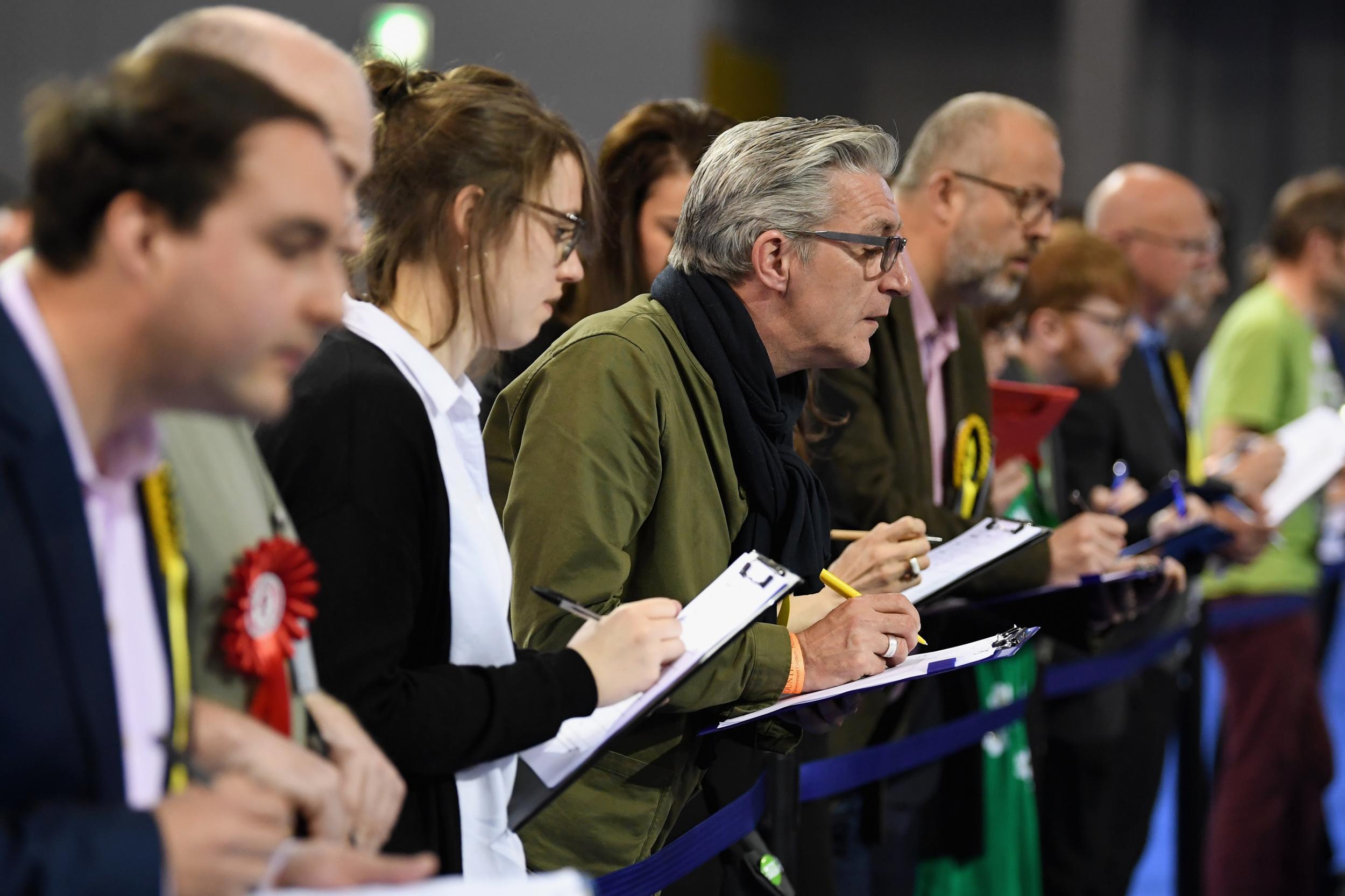 Electoral agents at the local election count in Glasgow's Emirates Arena