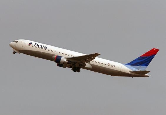 The man was flying from Seattle to Atlanta on a Delta Air Lines flight