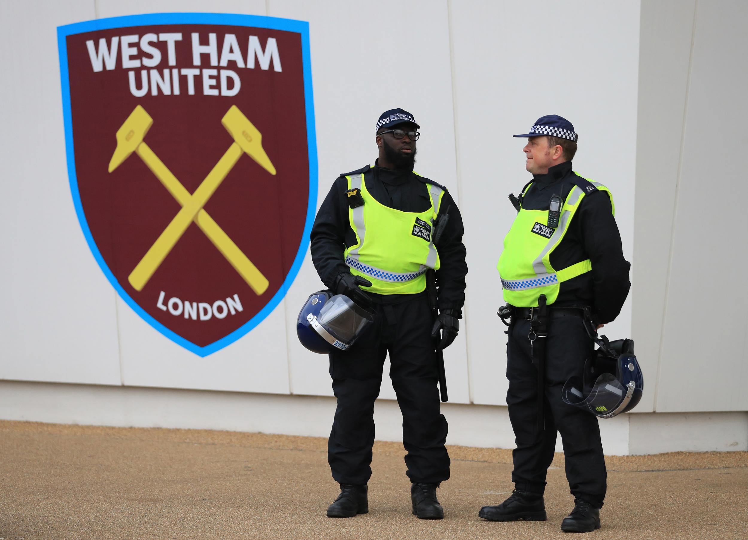 Police officers stand outside the London Stadium prior to kick-off