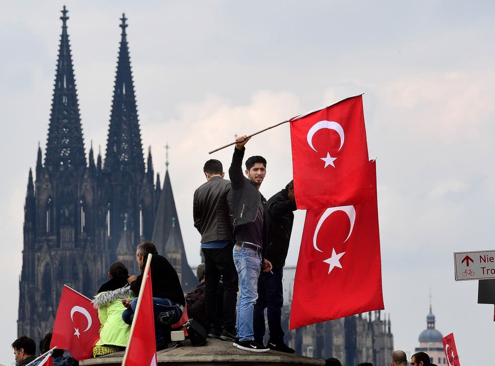 Hundreds of President Erdogan's supporters have protested in Germany following the coup