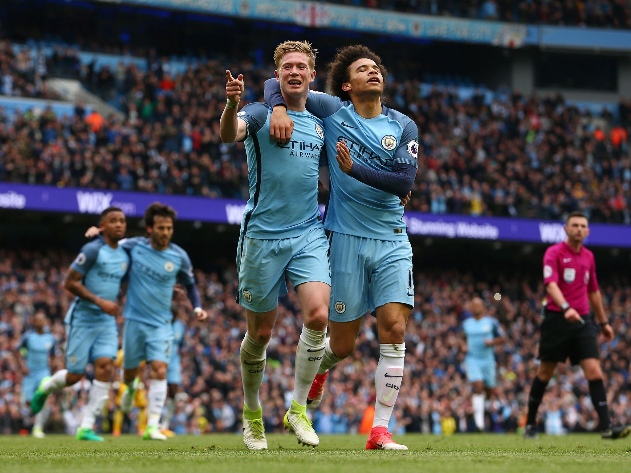 Kevin De Bruyne celebrates with Leroy Sane after netting the third