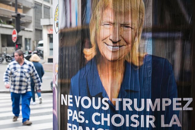 An anti-Le Pen poster in Paris depicts the Front National leader with the face of US President, reading: ‘Do not Trump yourself. Choose France. Vote!’ (Ge
