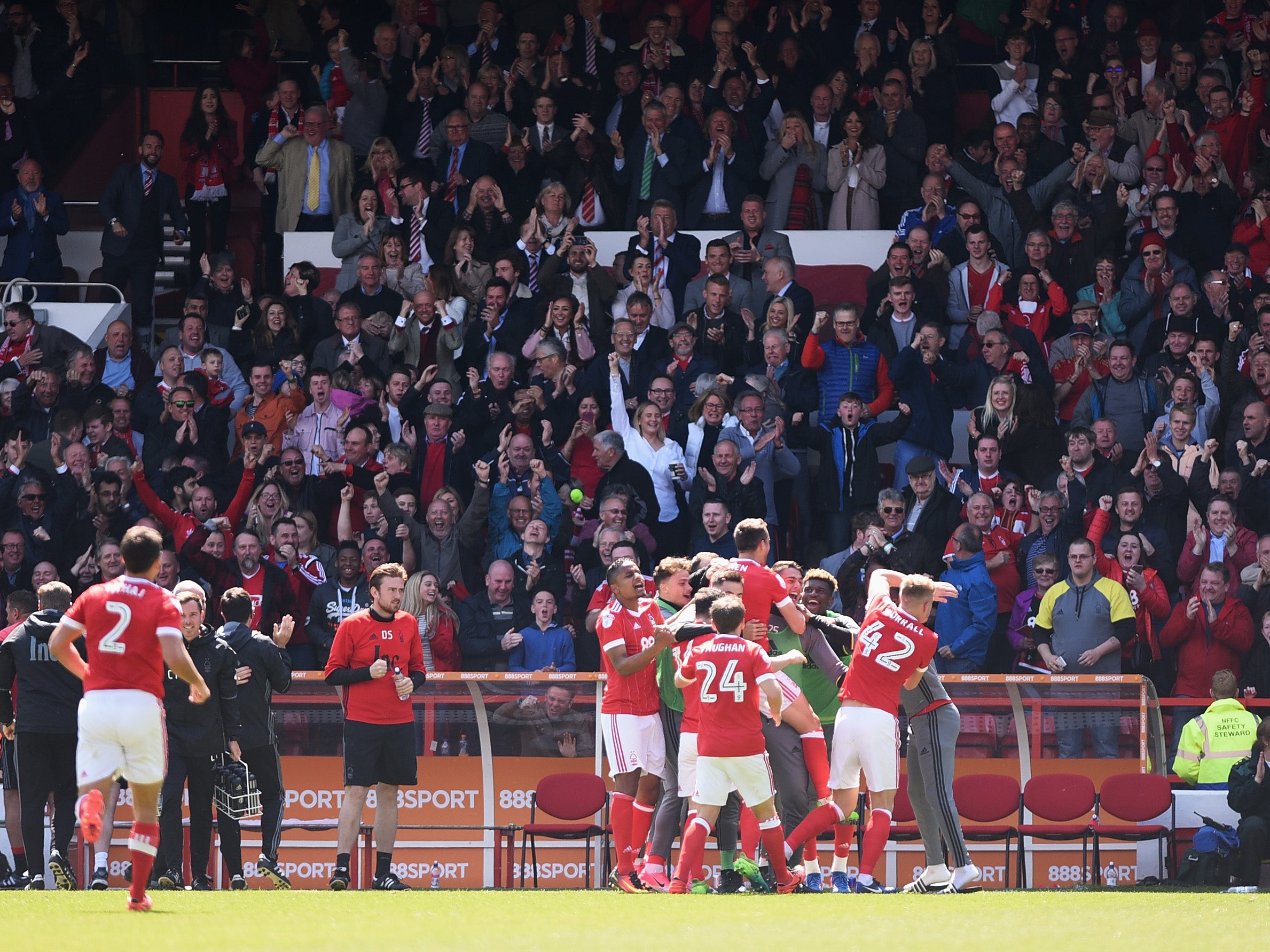 Forest celebrate remaining in the Championship at the end of the match